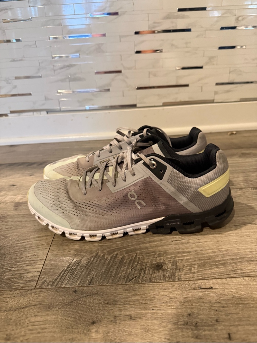 On Running Cloudswift Athletic Shoes in Gray and Black with Yellow Accent